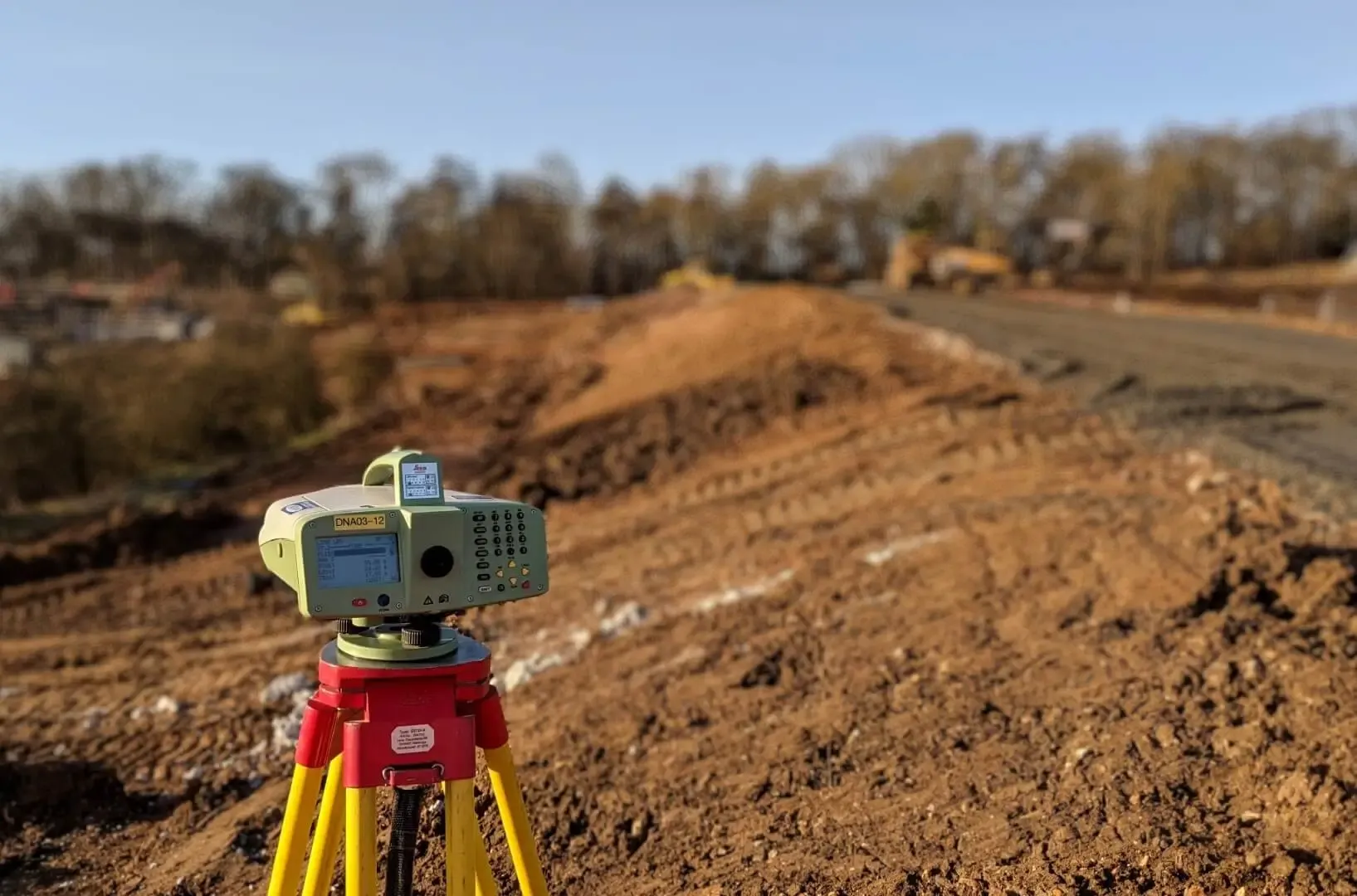 Site assessment on a sloped coastal plot in Nicaragua showing terrain factors that affect construction cost