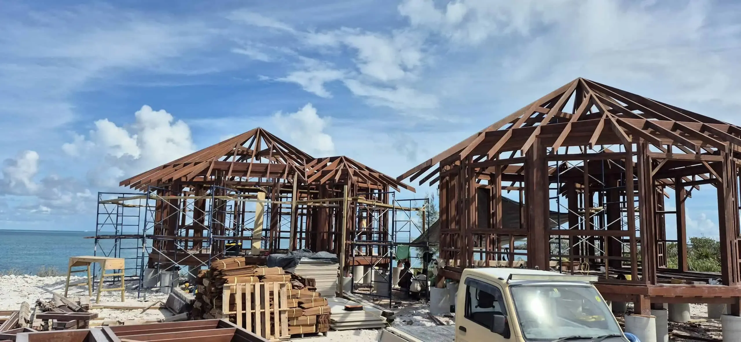 Residential construction in progress on the Nicaraguan Pacific coast, warm afternoon light on concrete and wood finishes